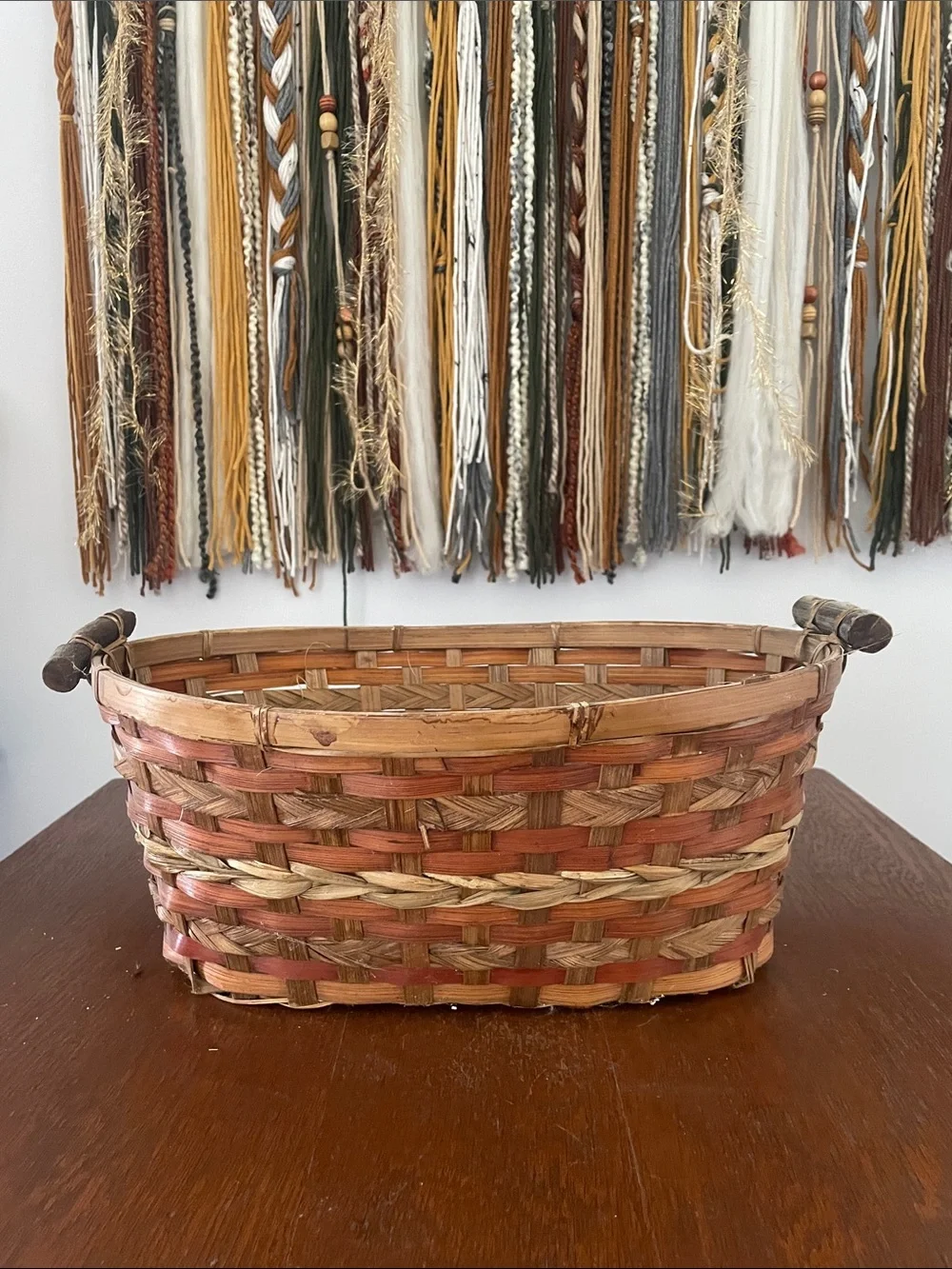 Brown and tan basket with handles